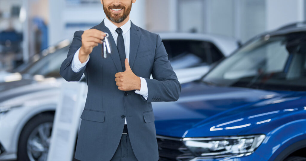 Portrait of Muhammad Adil Chughtai
Alt text: "Muhammad Adil Chughtai, founder of Bissmillah Motors, a seasoned investment banker with over 15 years of wealth management experience."

Image of Bissmillah Motors showroom
Alt text: "Bissmillah Motors showroom in Tanzania, showcasing a wide selection of cars for sale."